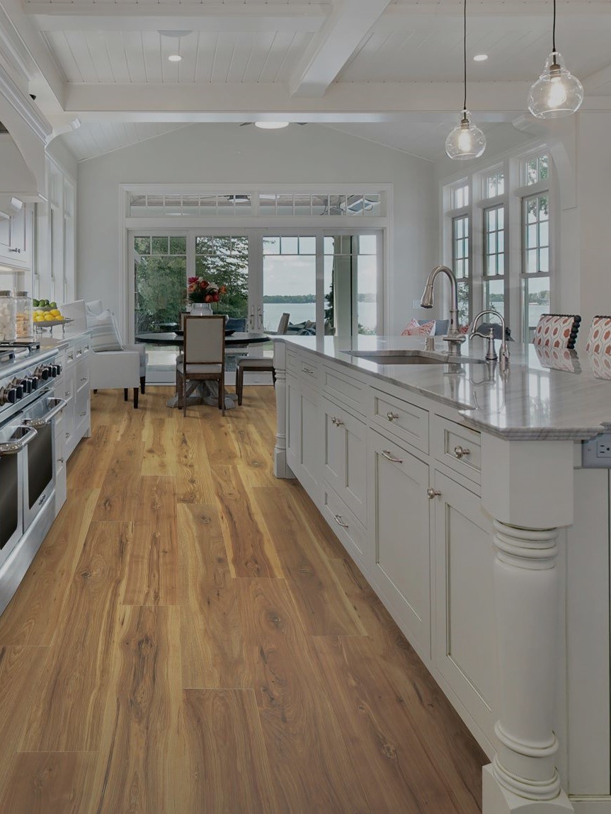 Kitchen with hardwood flooring and pendant lighting
