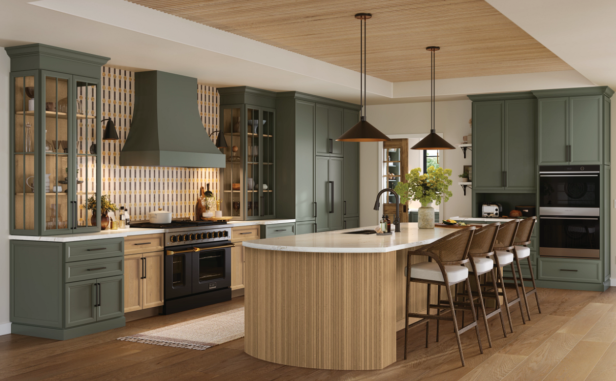 Kitchen with green cabinetry and reeded wood kitchen island