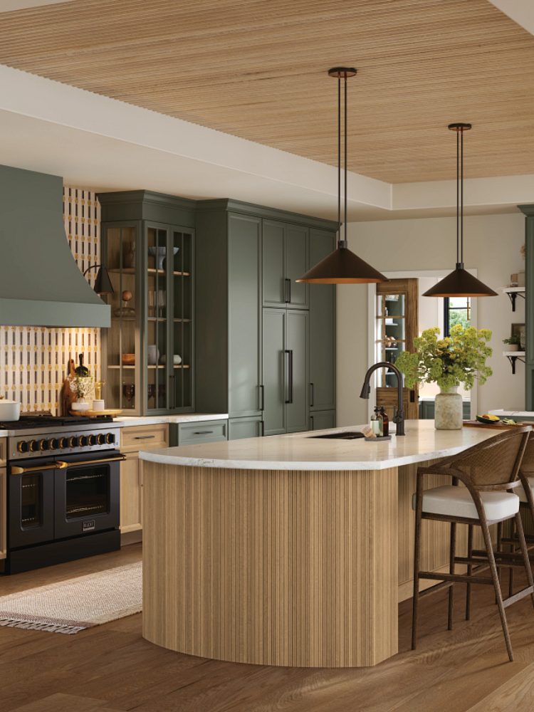 Kitchen with green cabinetry and reeded wood kitchen island