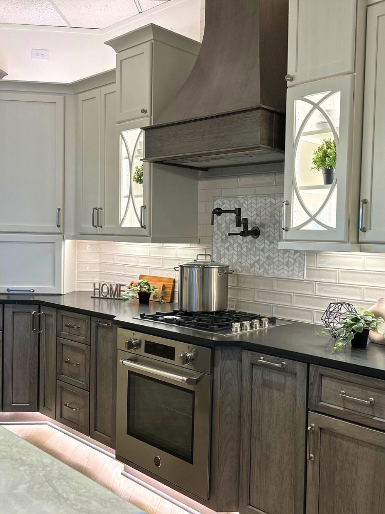 Custom wood cabinetry in a kitchen with black countertops