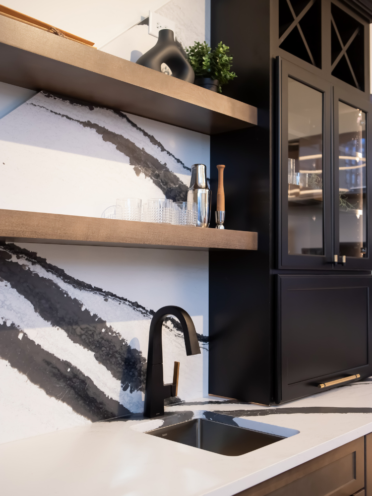 black countertops in a kitchen with terracotta cabinets