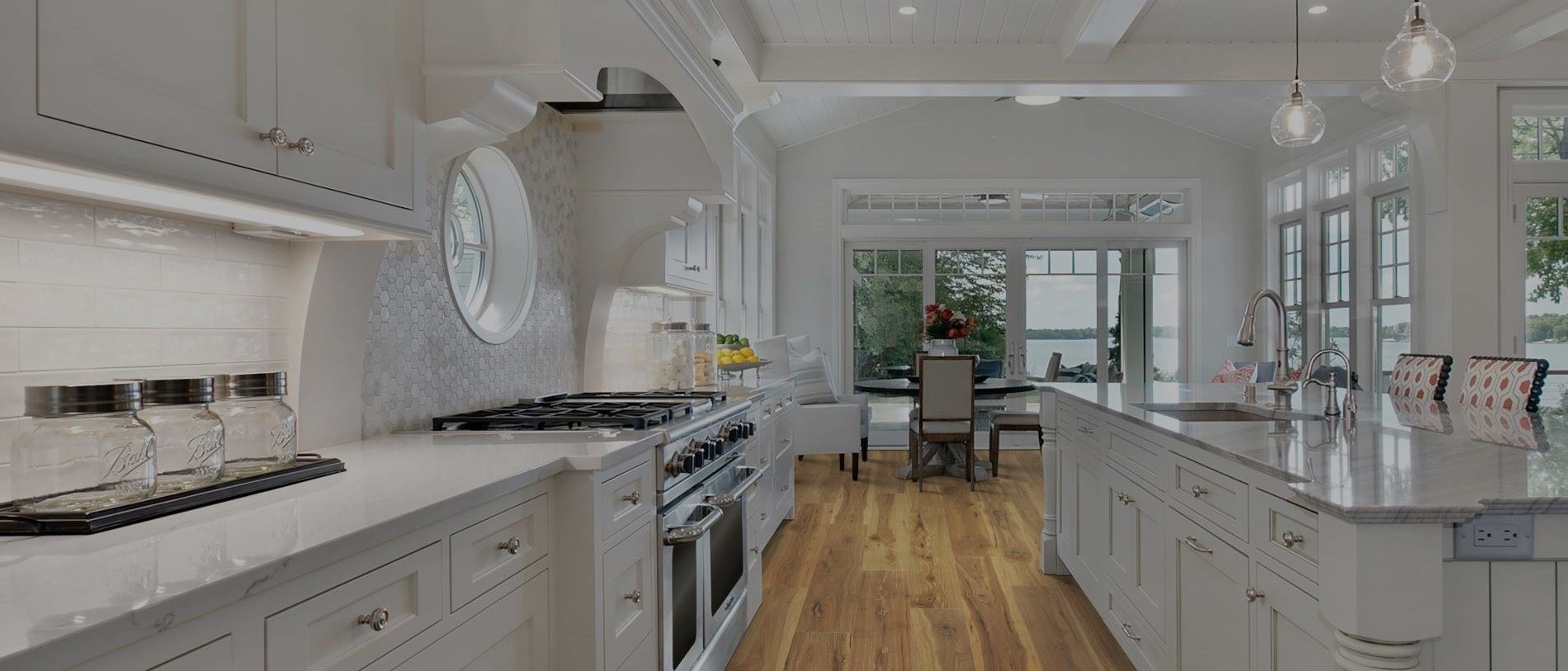 Kitchen with hardwood flooring and pendant lighting