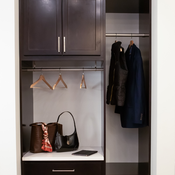 Closet with custom wooden cabinetry