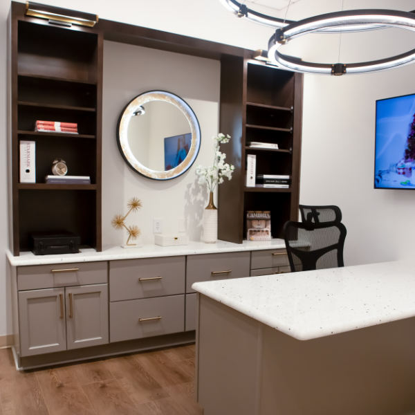Home office with cabinets and white countertops
